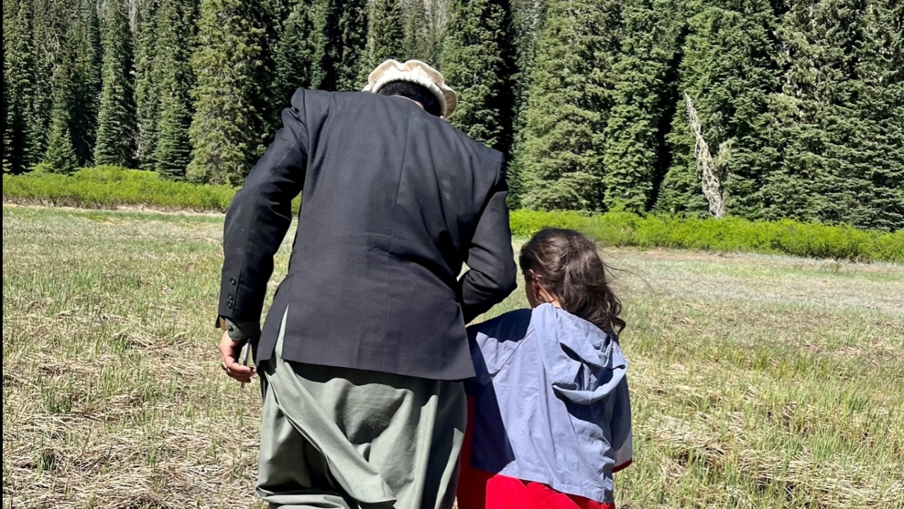 A 10-year-old holds hands with her father after going missing for a day.