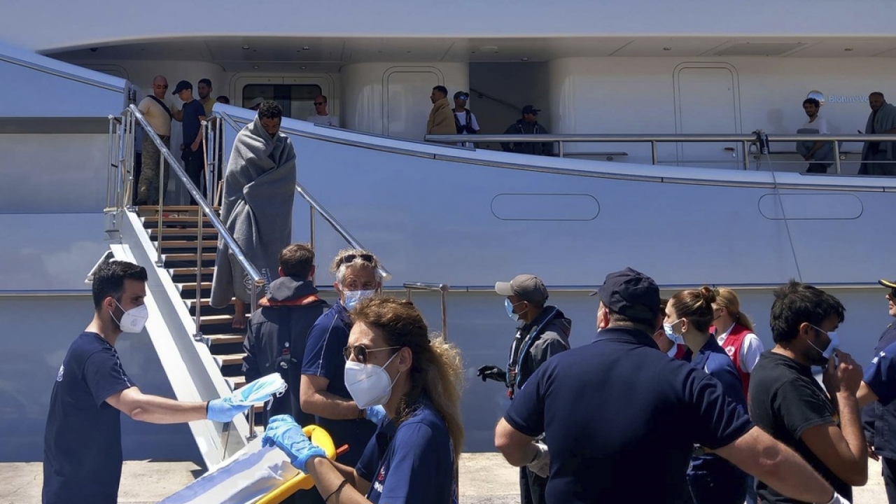 Survivors of a capsized boat arrive in Greece.