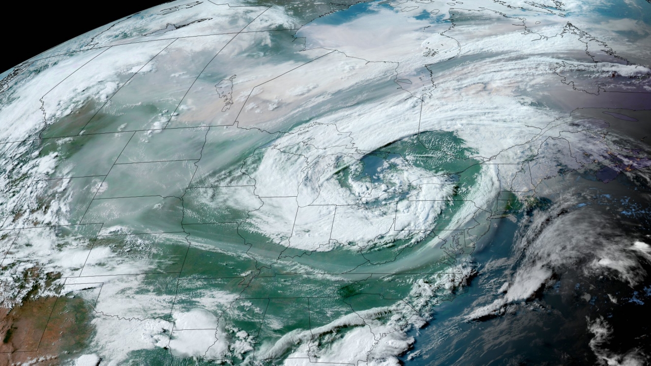 Satellite image of low pressure system and the smoke wrapping around it.