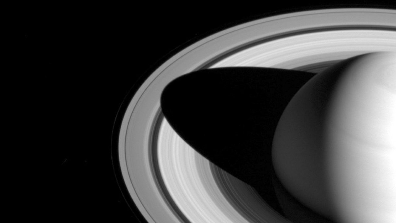 The shadow of Saturn on its rings.
