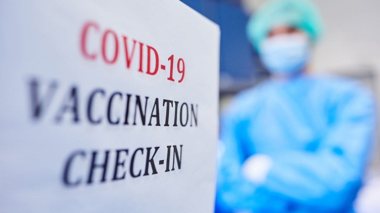 COVID-19 vaccine check-in sign