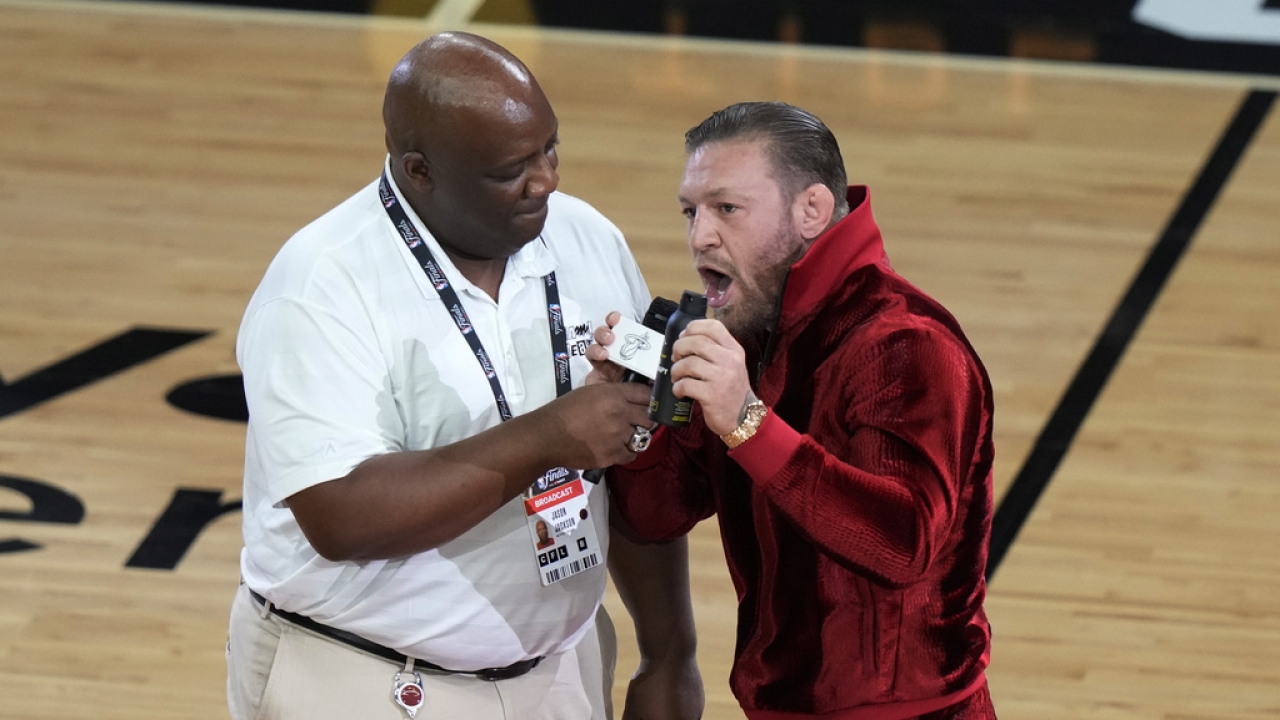 MMA fighter Conor McGregor speaks during a break in Game 4 of the basketball NBA Finals.