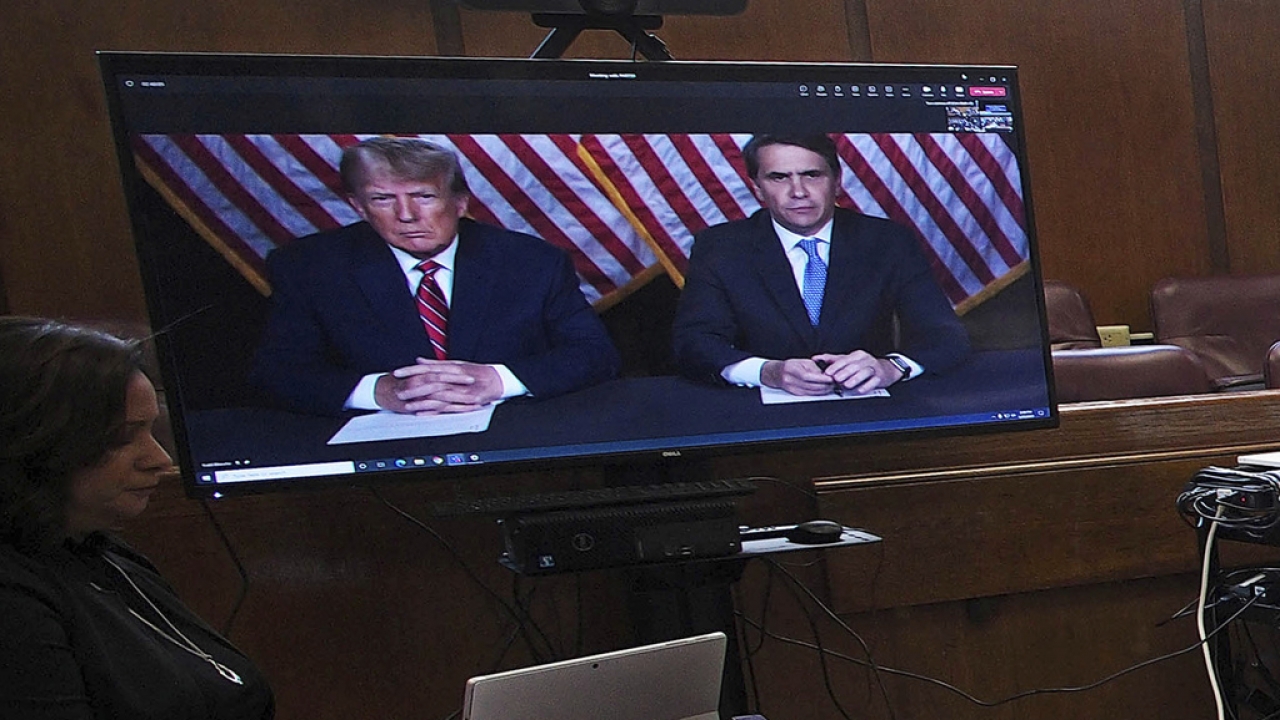 Former president Donald Trump, left on screen, and his attorney, Todd Blanche, right on screen, appear by video .