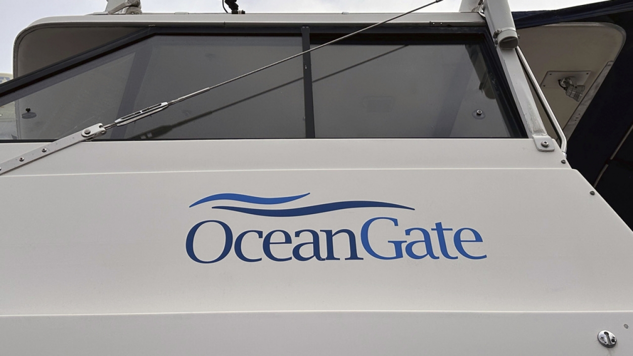 The logo for OceanGate Expeditions is seen on a boat parked near the offices of the company at a marine industrial warehouse.