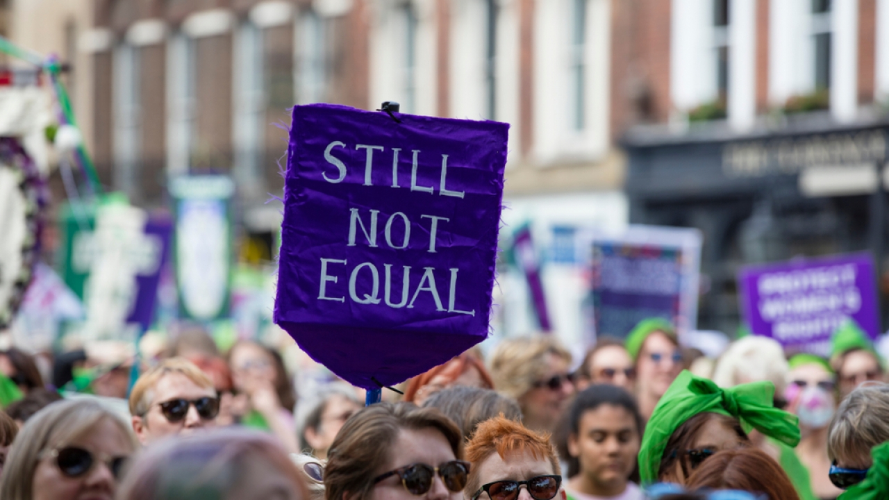 Thousands of woman and girls march in London celebrating 100 years of the women's vote in the U.K.