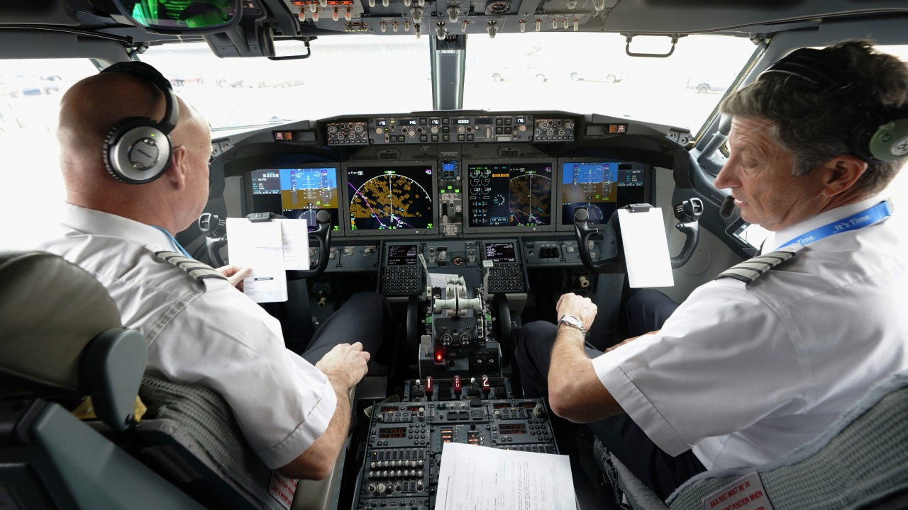 American Airlines pilot captain and first officer conduct a pre-flight check before taking off on Dec. 2, 2020.