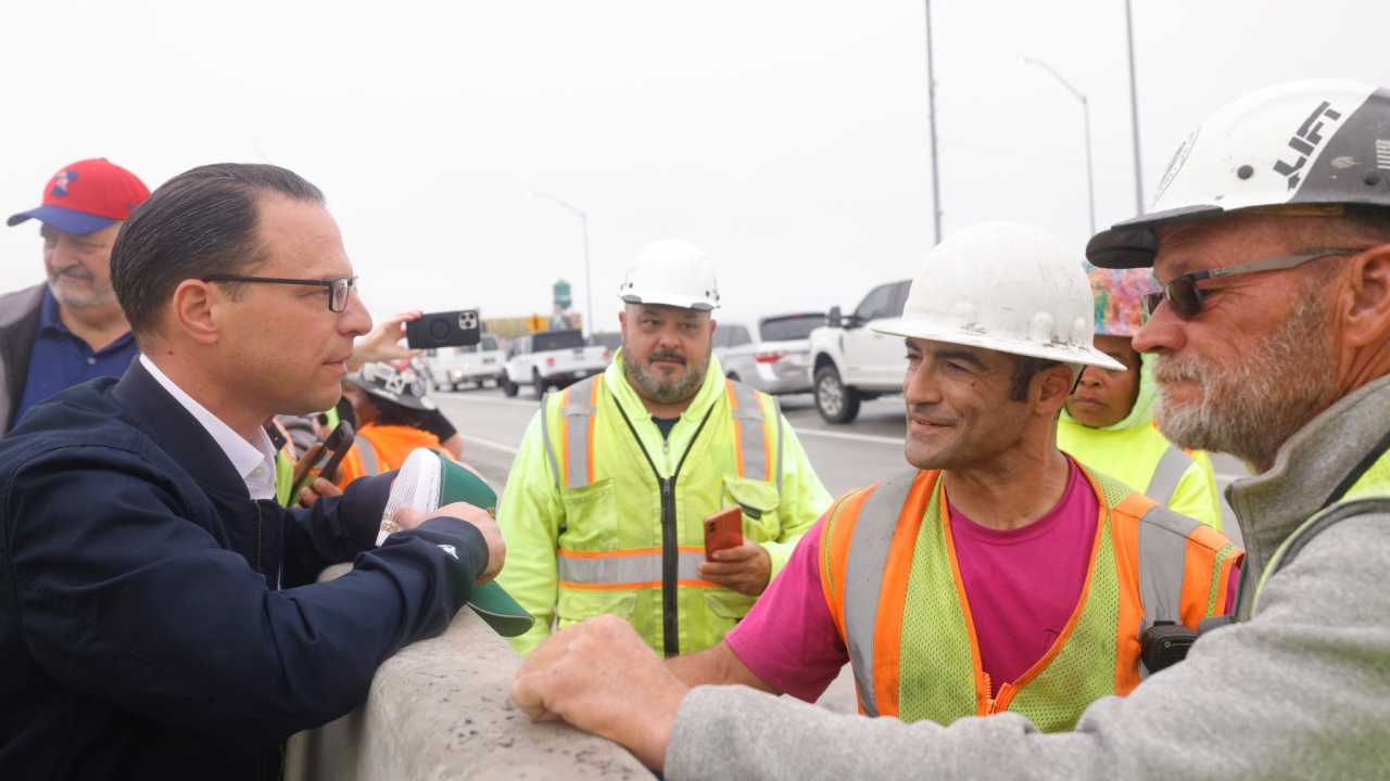 Pennsylvania Gov. Josh Shapiro speaks to workers on the temporarily rebuilt I-95 in Philadelphia.