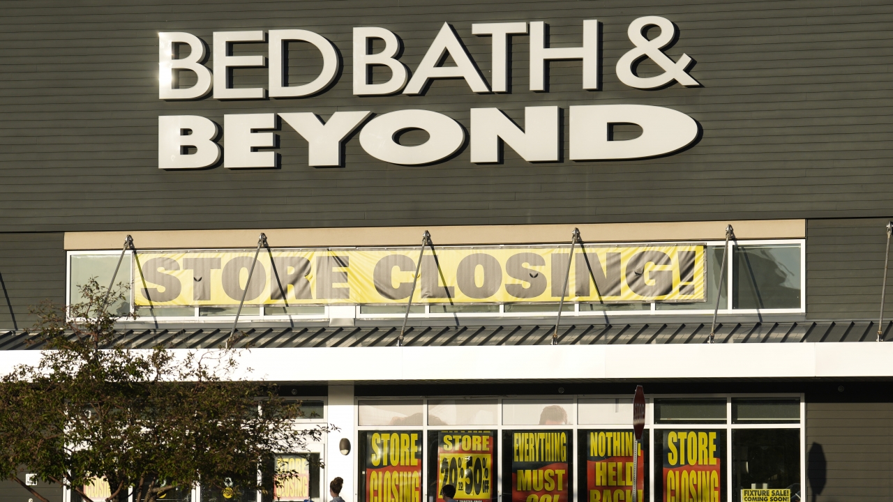 Shoppers enter exit a Bed Bath & Beyond.
