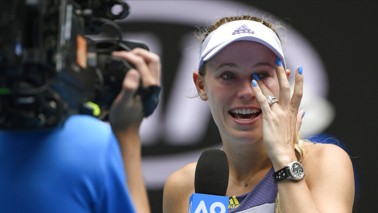 Denmark's Caroline Wozniacki wipes away tears after her last match in January 2020.