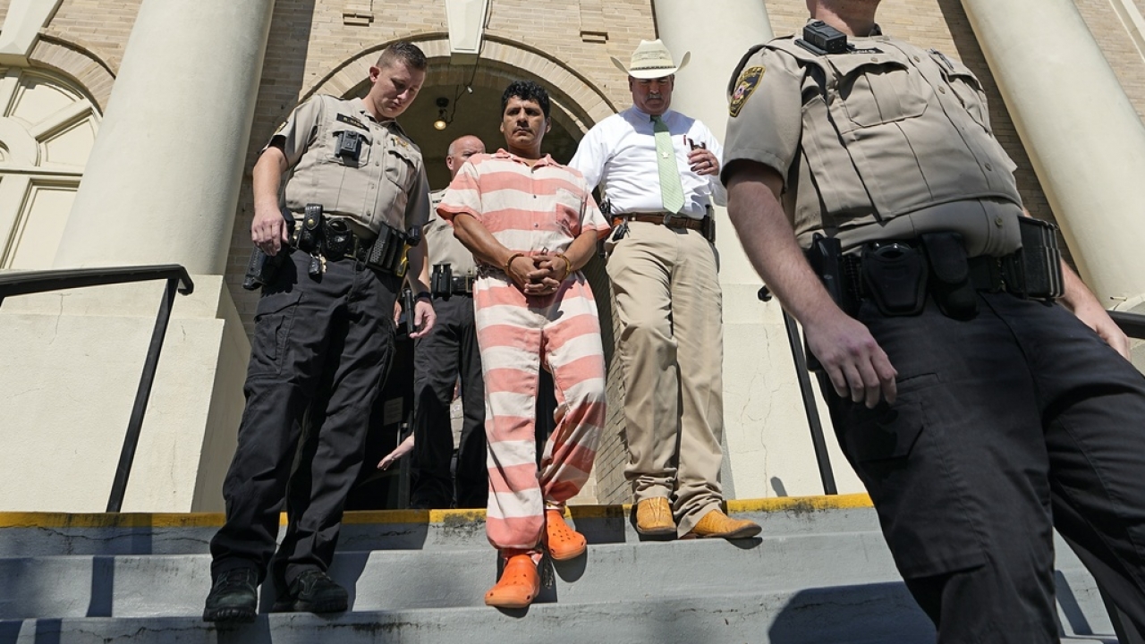 Francisco Oropeza is escorted from the San Jacinto County courthouse by San Jacinto County Sheriff Greg Capers