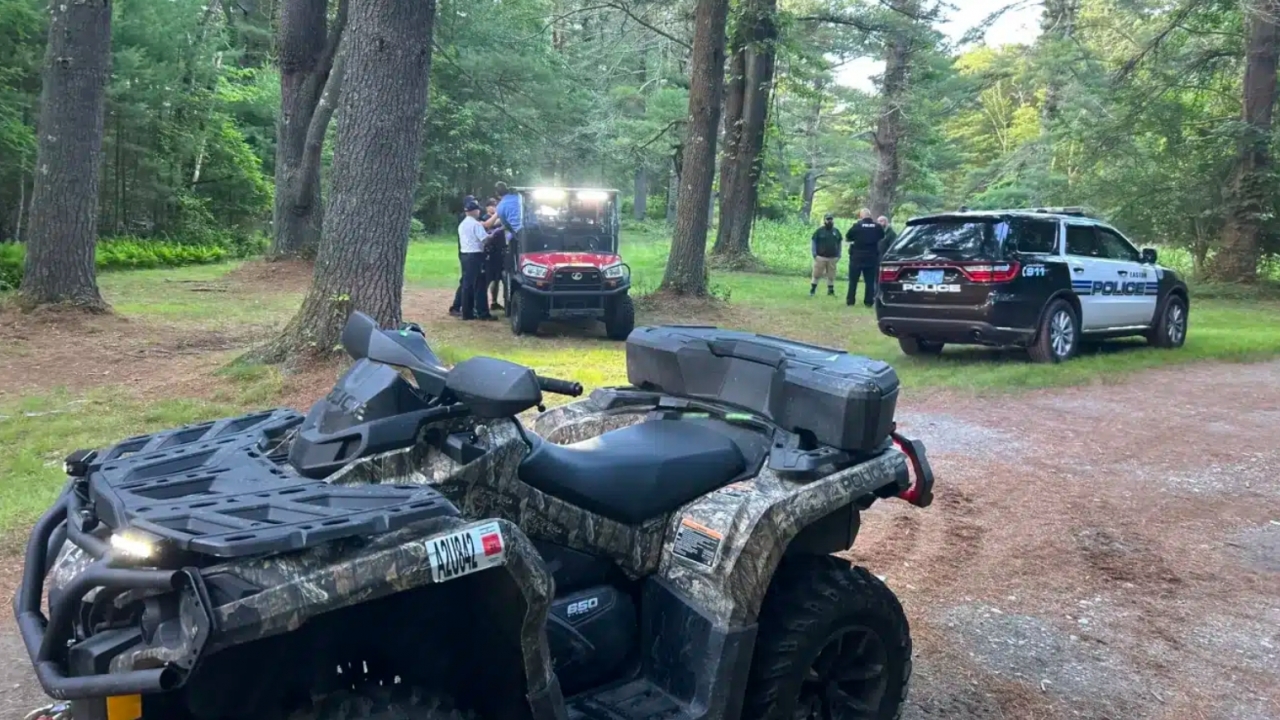 Police use an ATV to reach a missing Massachusetts woman in a state park.