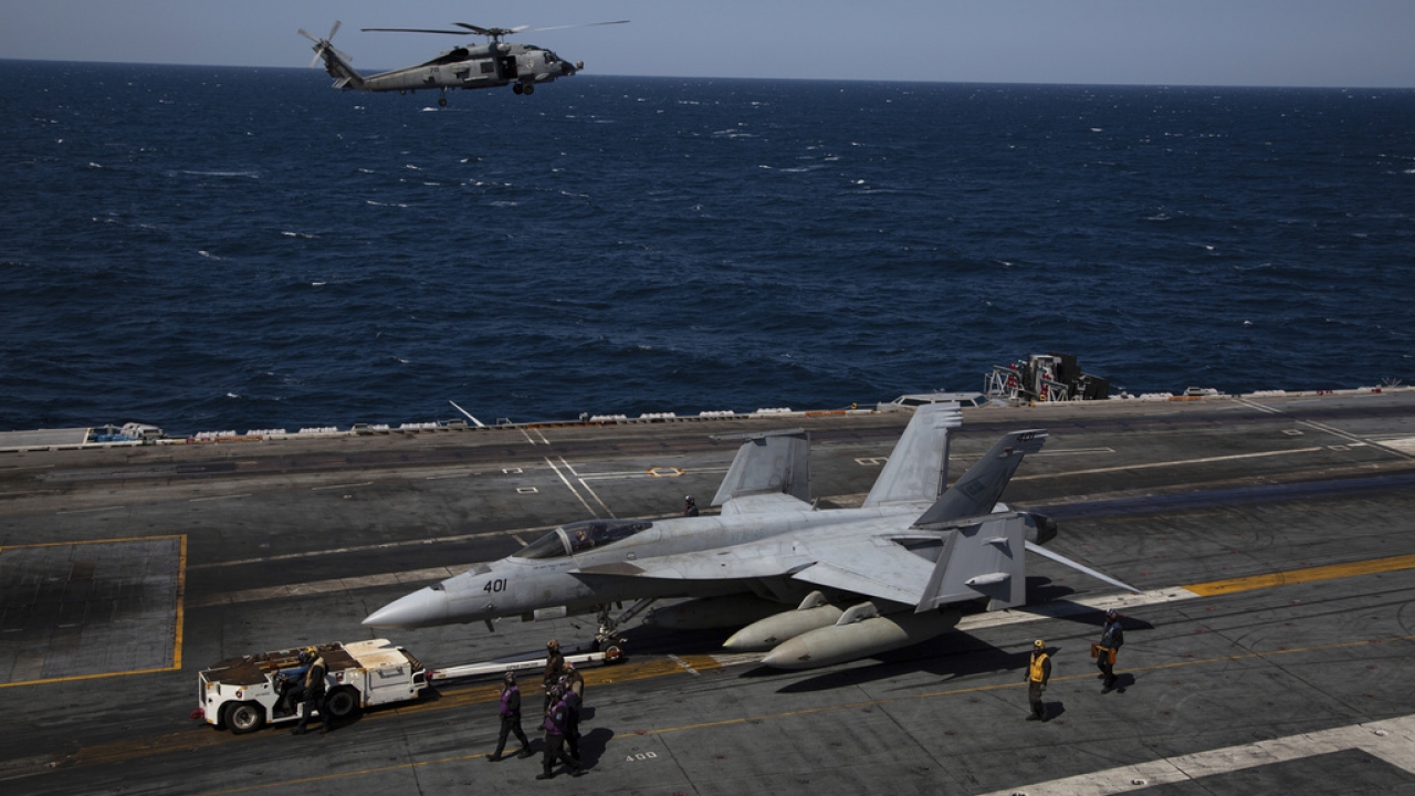 U.S. Navy MH-60S Hawk helicopter, and F-18 Super Hornets.