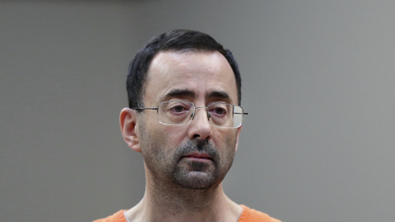 Dr. Larry Nassar appears in court for a plea hearing in Lansing, Michigan.
