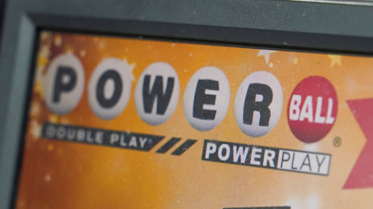 A display panel advertises tickets for a Powerball drawing at a convenience store.