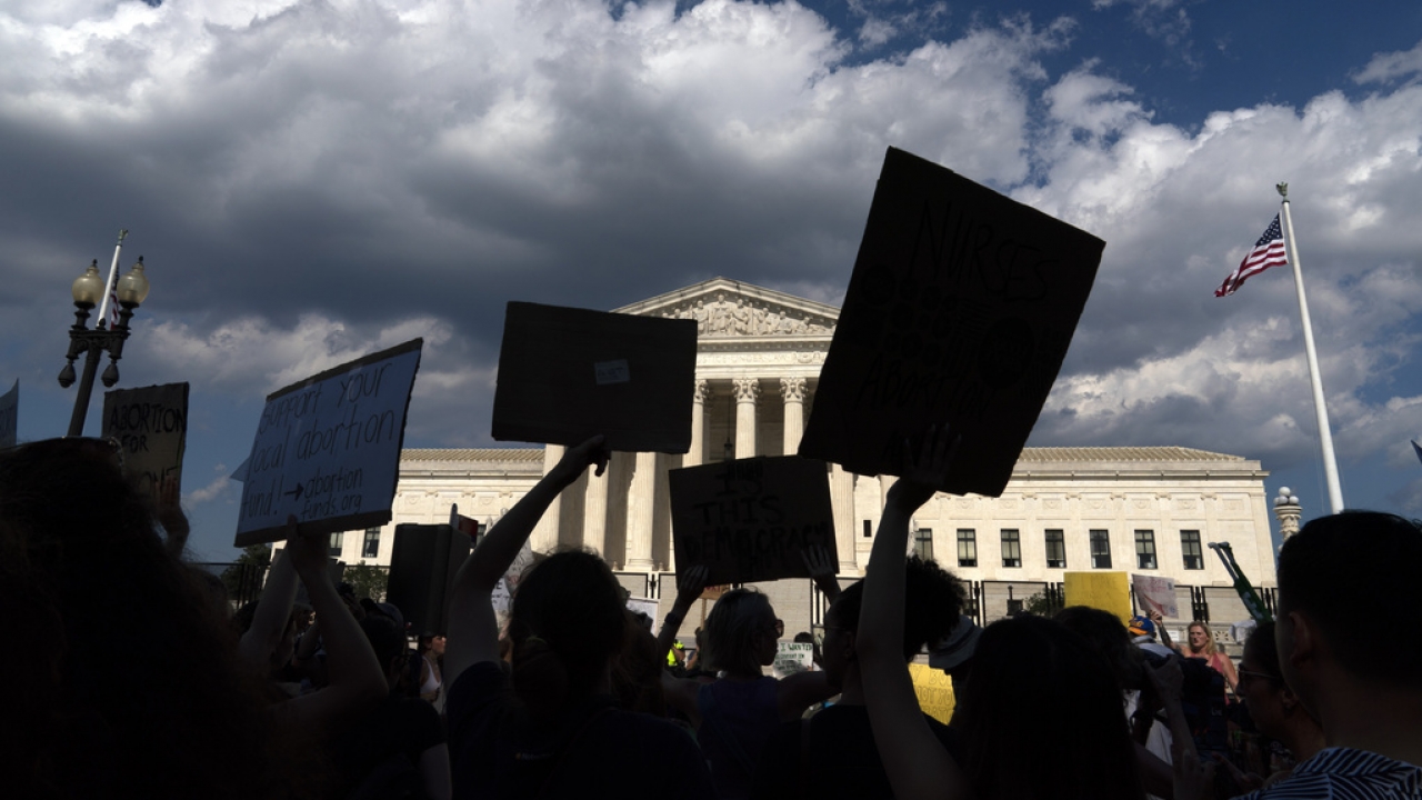 Abortion-rights activists protest outside the Supreme Court in Washington.