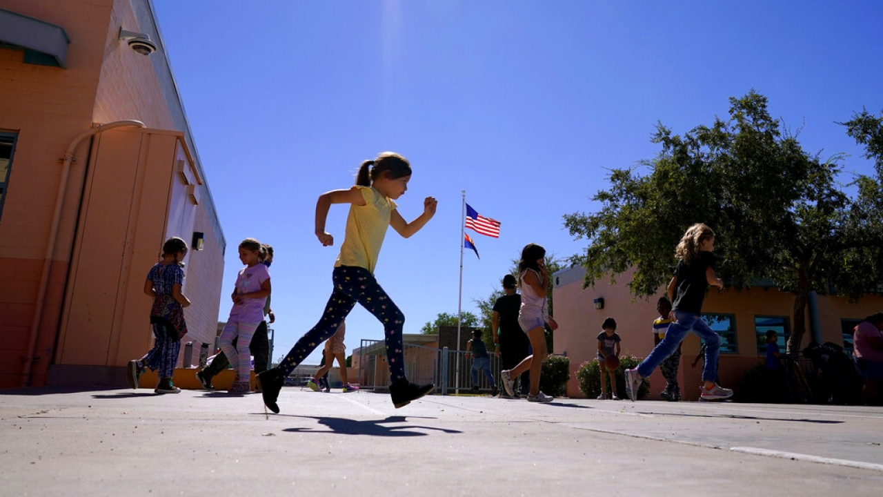 Elementary School students enjoy recess in the sun.