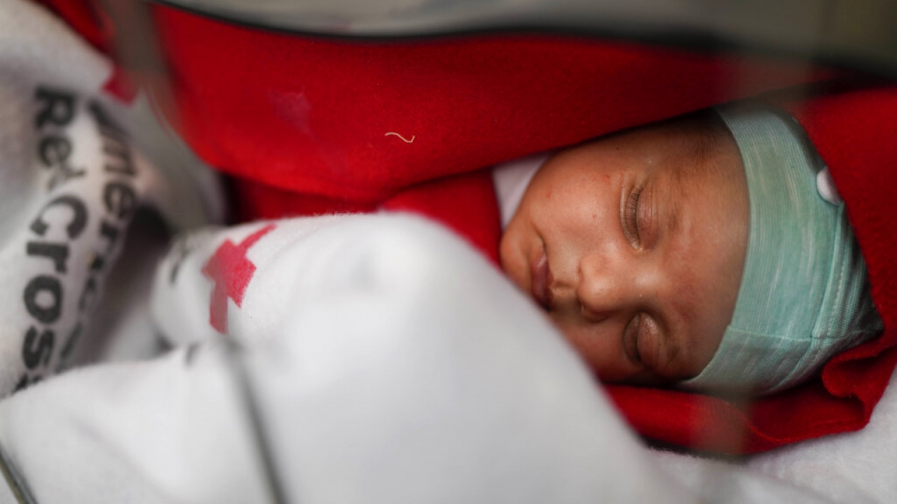 A 15 day old boy from Afghanistan sleeps.
