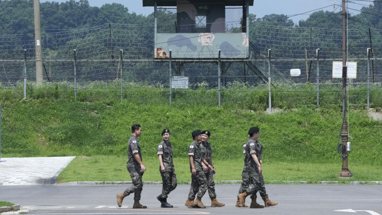 South Korean army soldiers pass by a military guard post near the border with North Korea