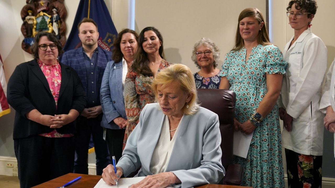 Maine Gov. Janet Mills signs a bill into law.