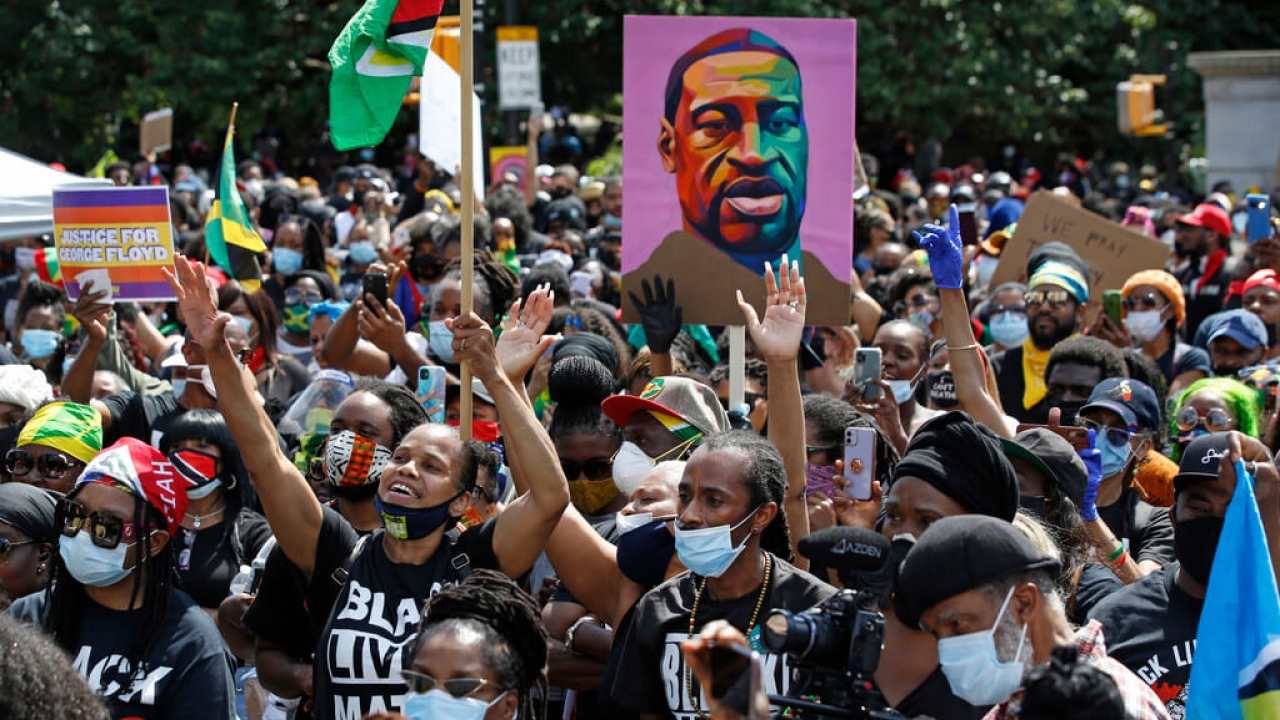 People participate in a Caribbean-led Black Lives Matter rally.