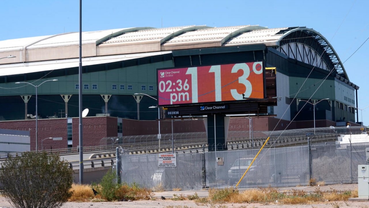 A billboard displays temperatures in Phoenix, Arizona