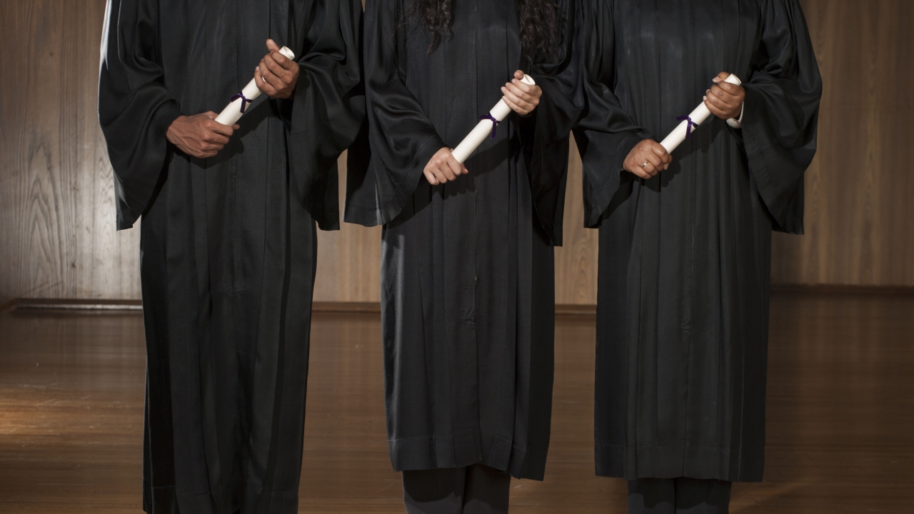 Graduates hold diplomas