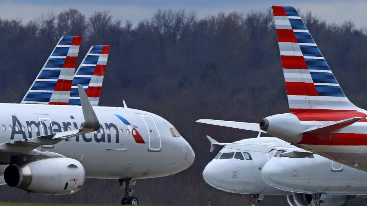Two American Airlines planes taxi.