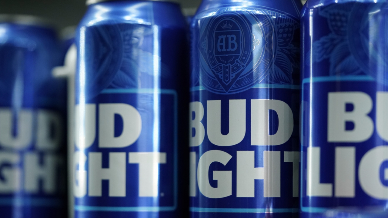 Cans of Bud Light beer are shown.