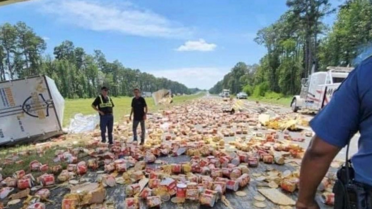 Truck crash spills nacho cheese on roadway.
