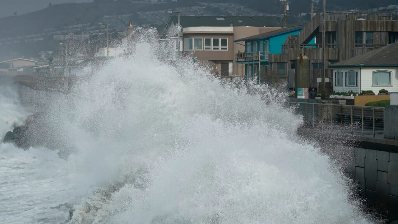 Large waves crash into a seawall in Pacifica, California.