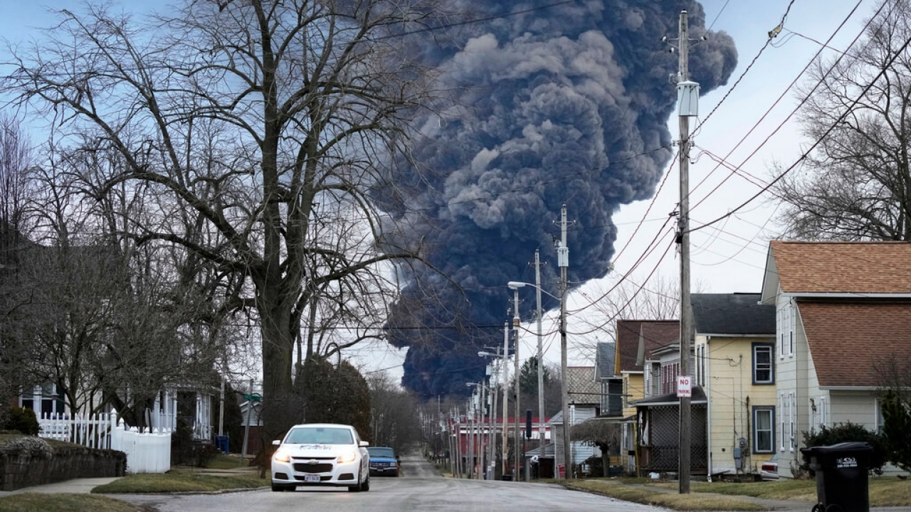 A black plume rises over East Palestine, Ohio,.