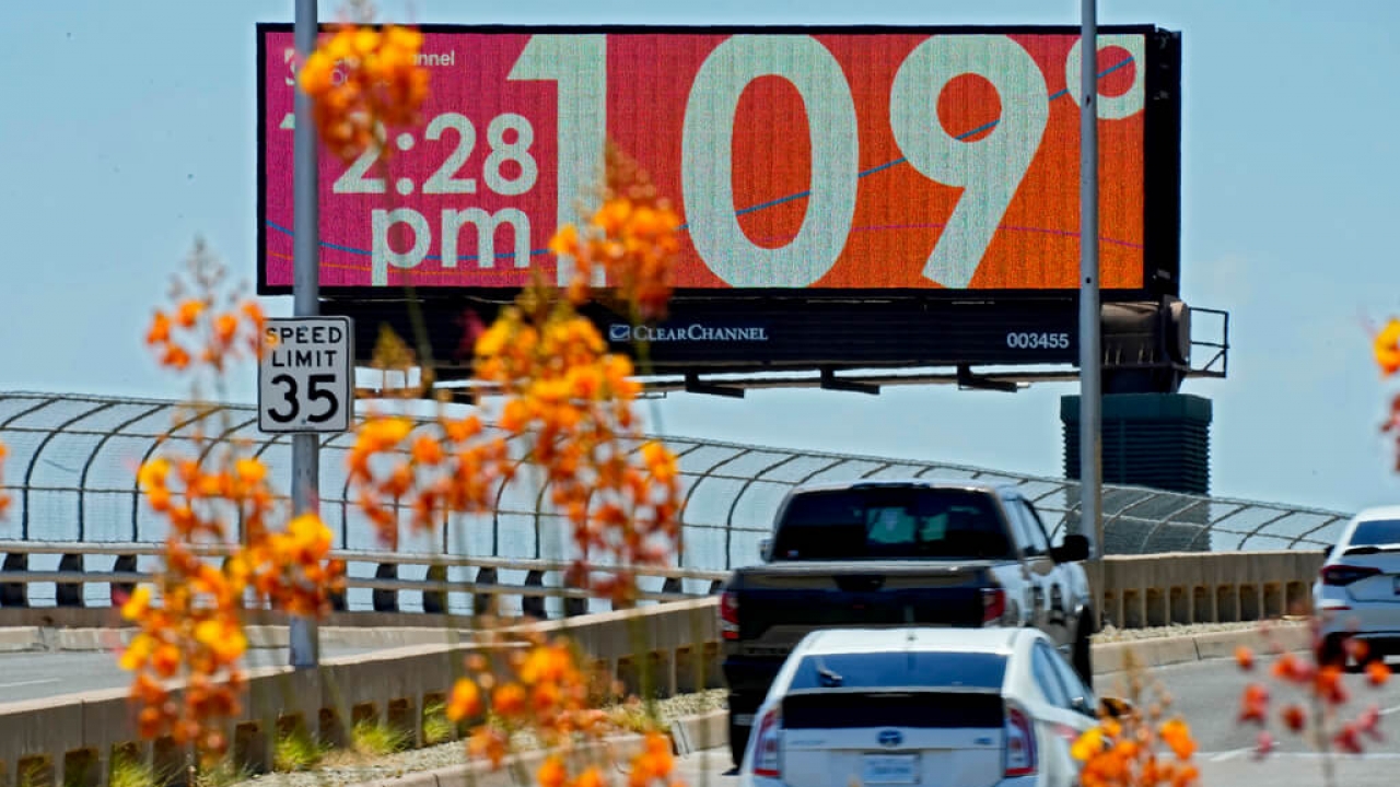 A billboard shows temperatures in Phoenix, Arizona