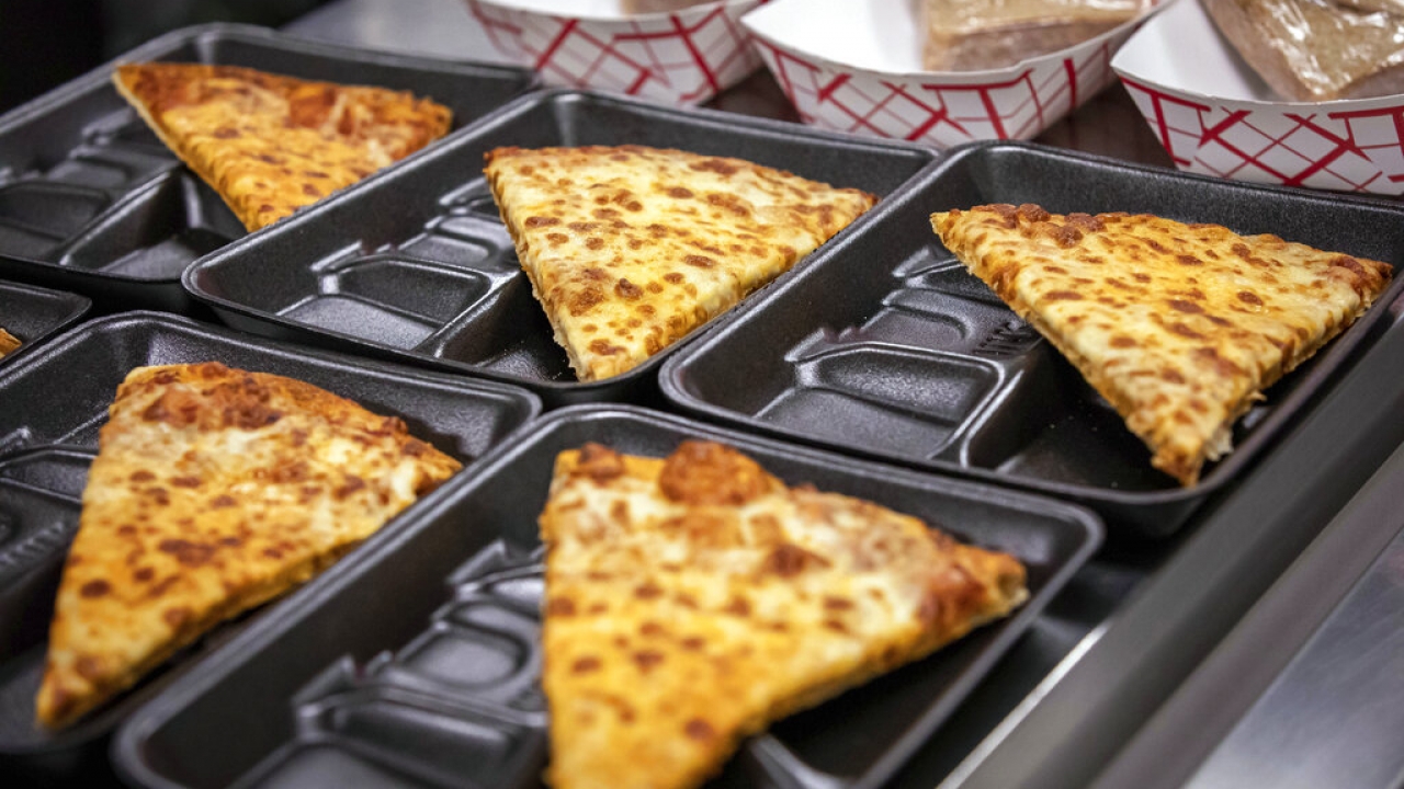 Pizza on school lunch trays.