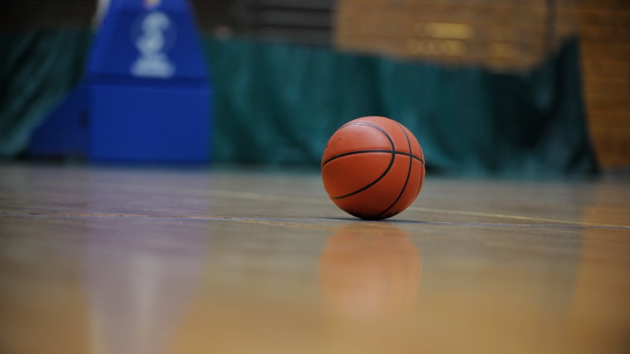A basketball on court.