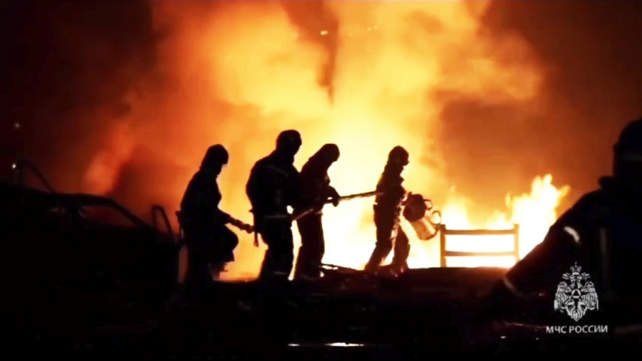 Firefighters work to extinguish a fire at a petrol station in Russia.