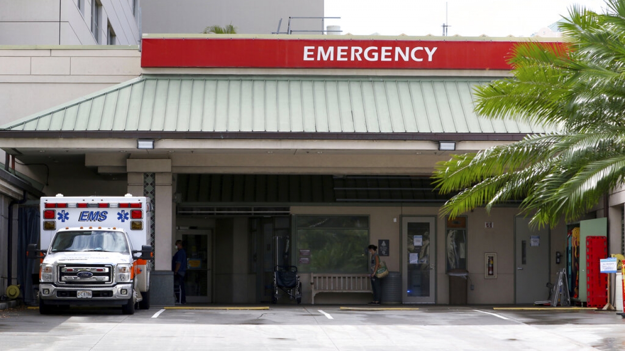 An ambulance sits outside the emergency room at The Queen's Medical Center in Honolulu.