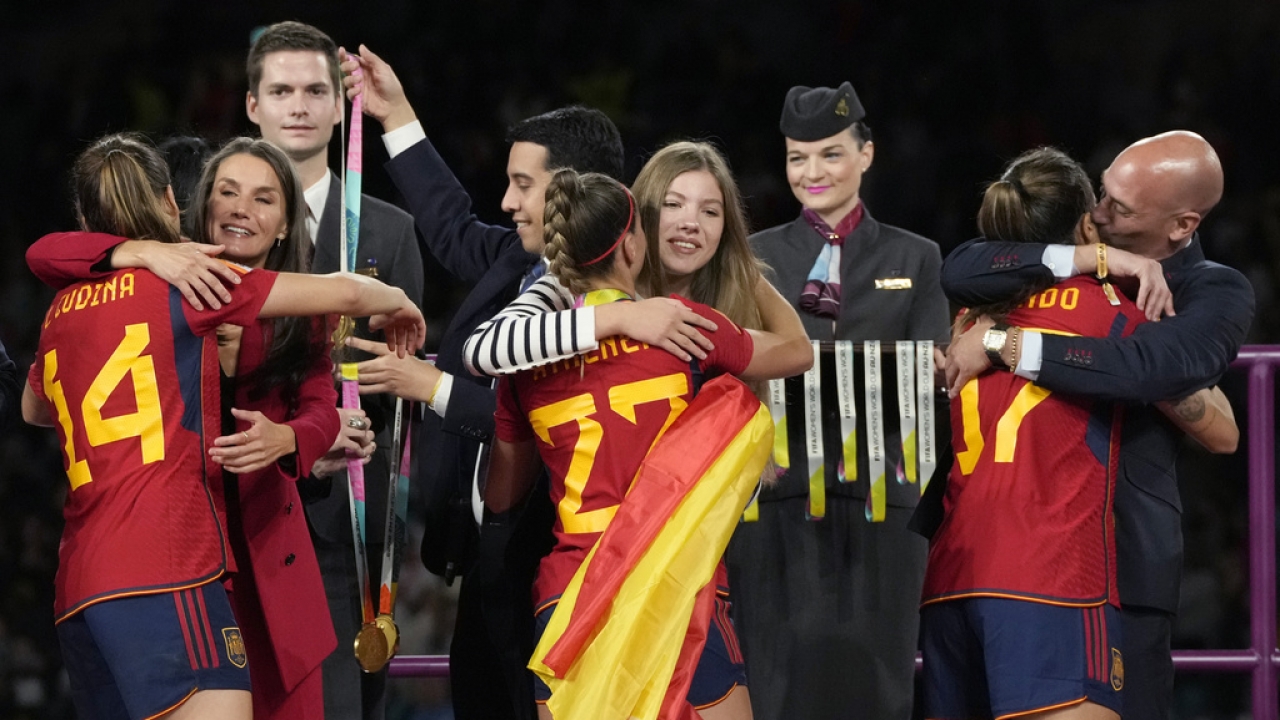 President of Spain's soccer federation, Luis Rubiales, right, embraces Alba Redondo.
