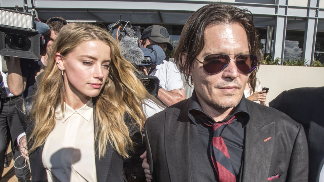 Johnny Depp and his then wife Amber HEard leave a court in Australia.