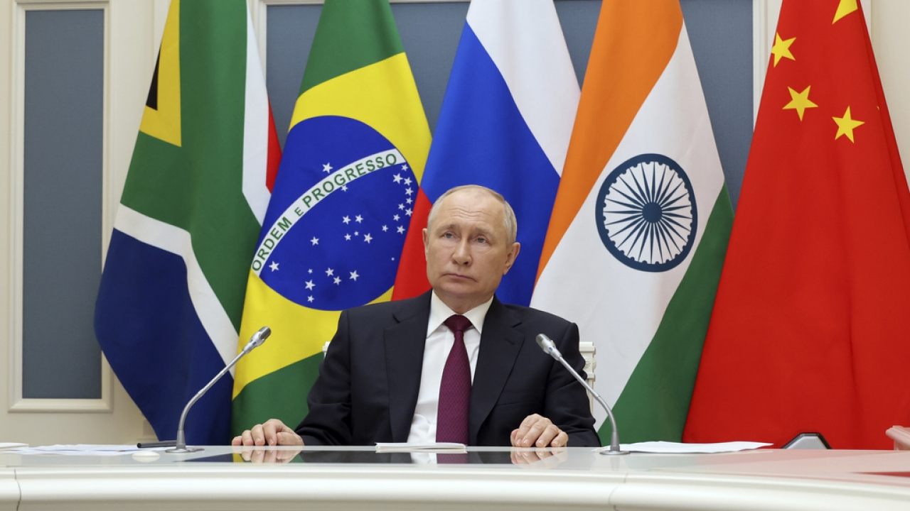 Russian President Vladimir Putin listens to leaders from the BRICS group of emerging economies.
