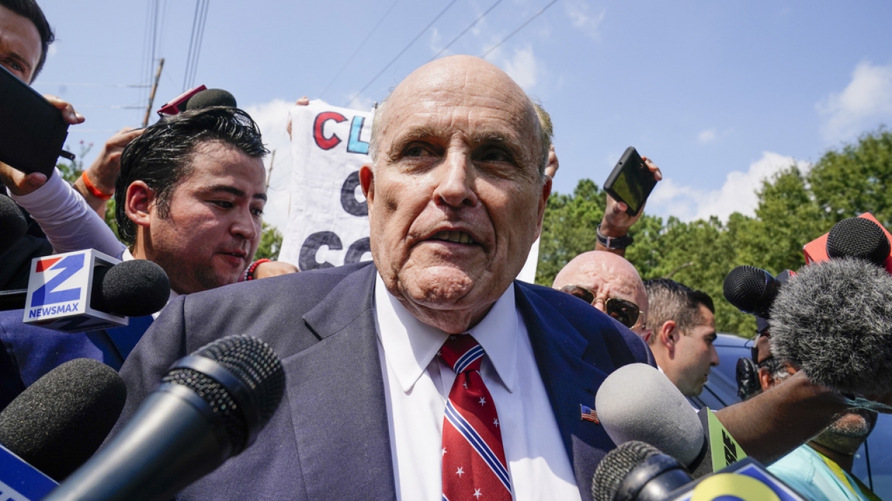 Rudy Giuliani speaks outside the Fulton County jail.