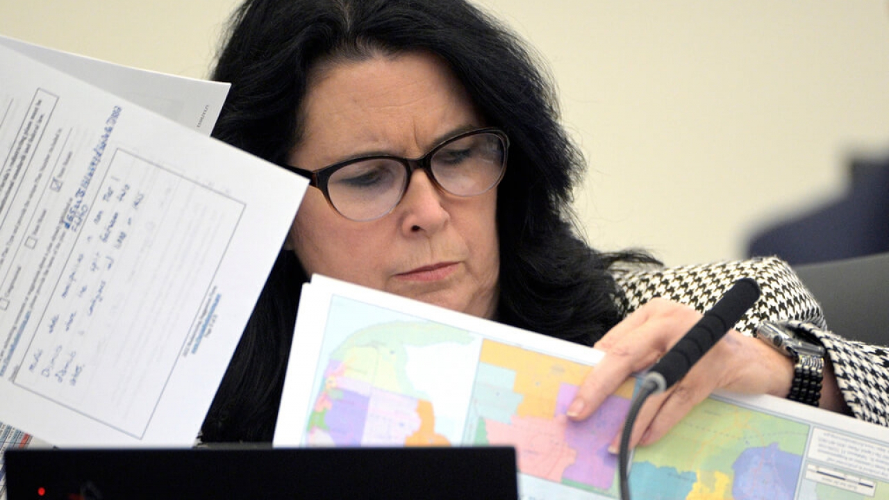 State Sen. Kelli Stargel looks through redistricting maps.