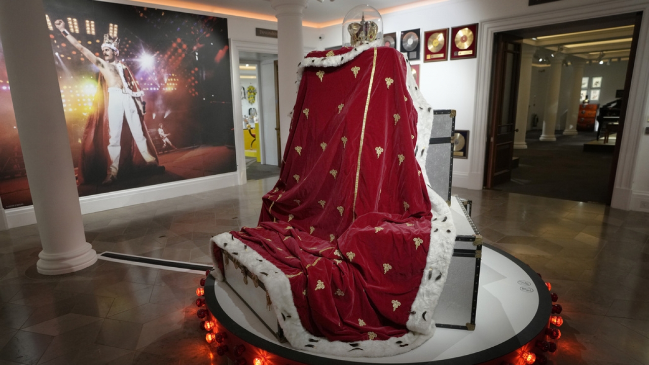 Freddie Mercury's signature crown and cloak ensemble, worn throughout the "Magic" Tour, on display at Sotheby's auction rooms