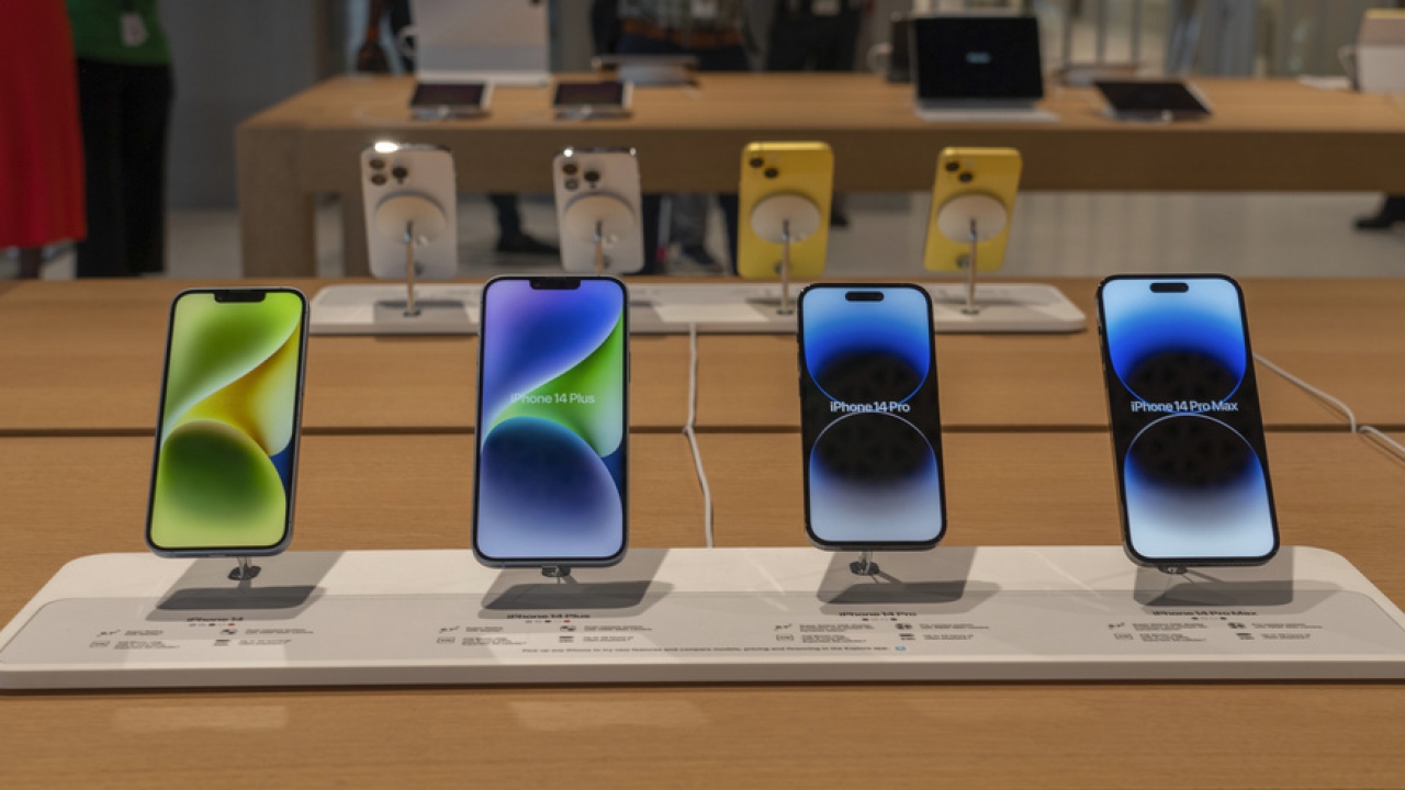 iPhone 14 models on display at a store