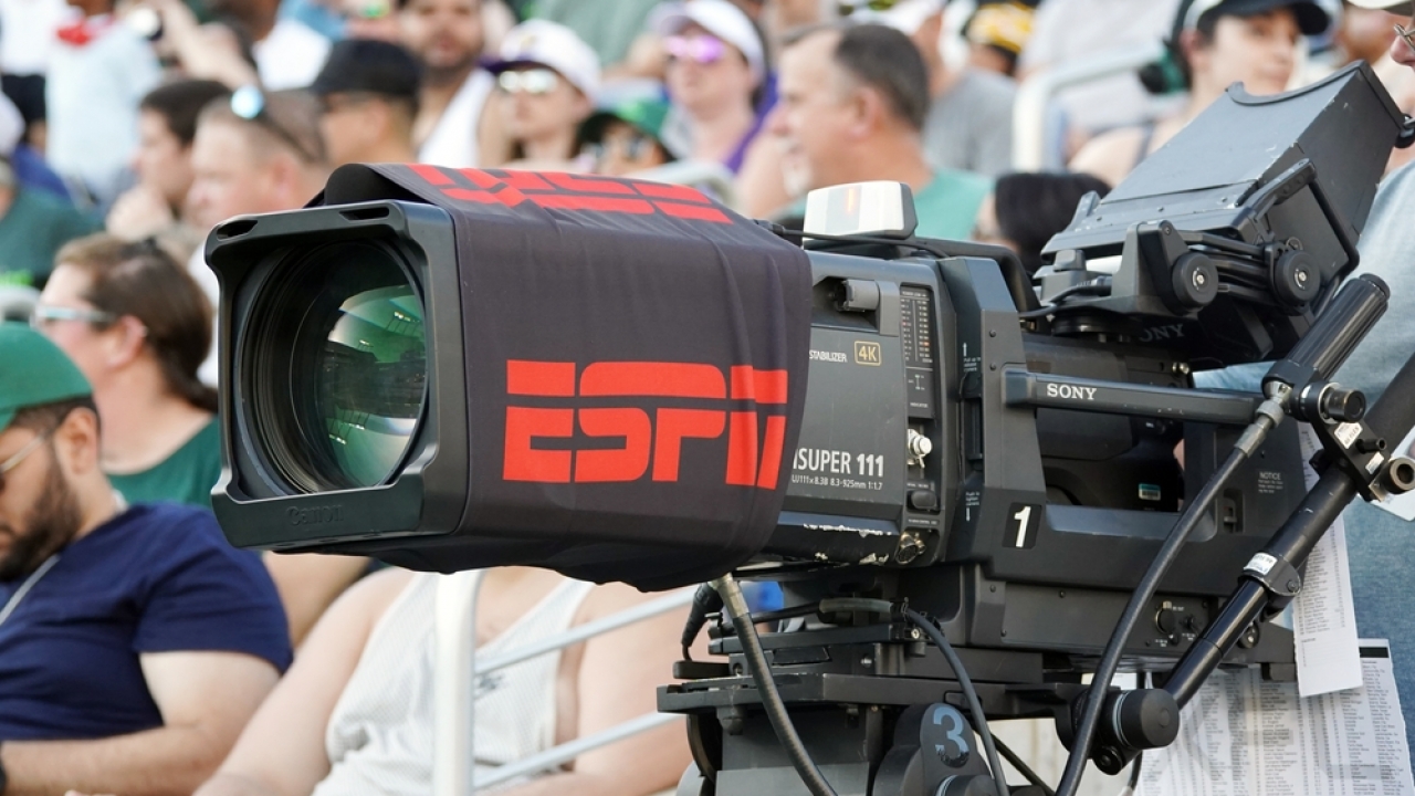A camera at a sporting event has the ESPN logo.