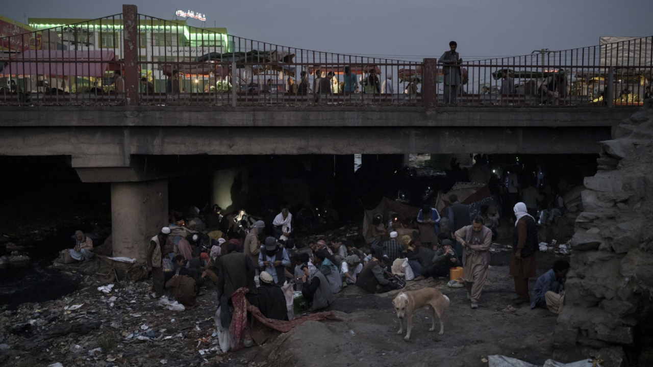 People in Afghanistan gather under a bridge to consume drugs.