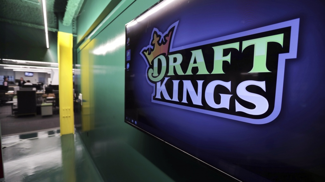 DraftKings logo appears on a TV screen