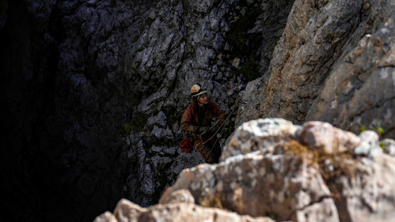 A rescue worker enters Morca Cave in Turkey