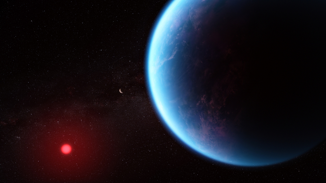 Artist's conception of Exoplanet K2-18 b, which shows a blue planet near a red star.