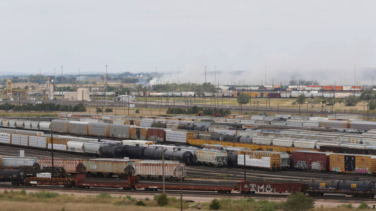 Smoke emanates from a railroad car after an explosion at Union Pacific's Bailey Yard.