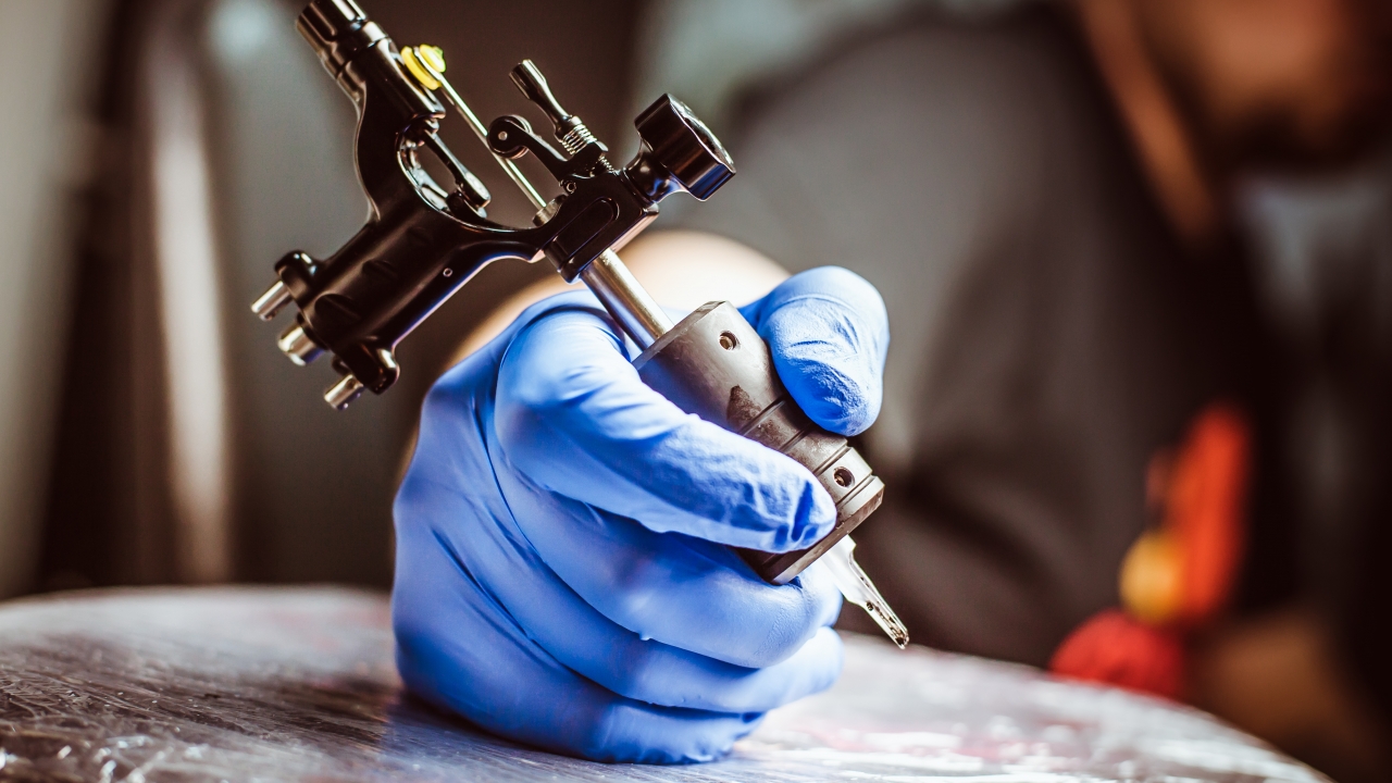 Closeup of a tattooist making a tattoo.
